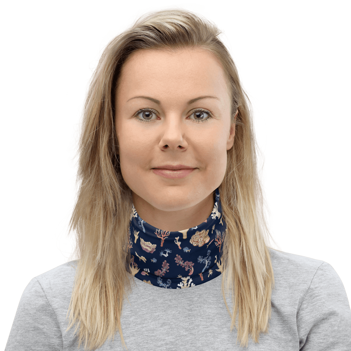 Woman wearing a navy blue neck warmer with coral design