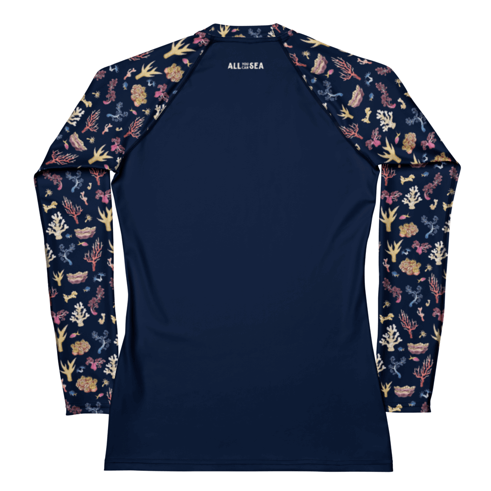 Back of All You Can Sea navy blue rashguard with a colorful coral and sea life pattern and the name of the brand visible on the top