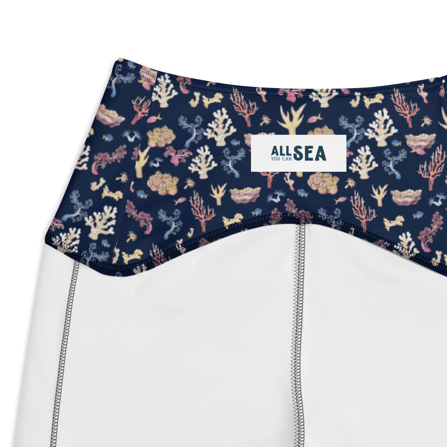 details of a navy blue leggings with a colorful coral and sea life pattern