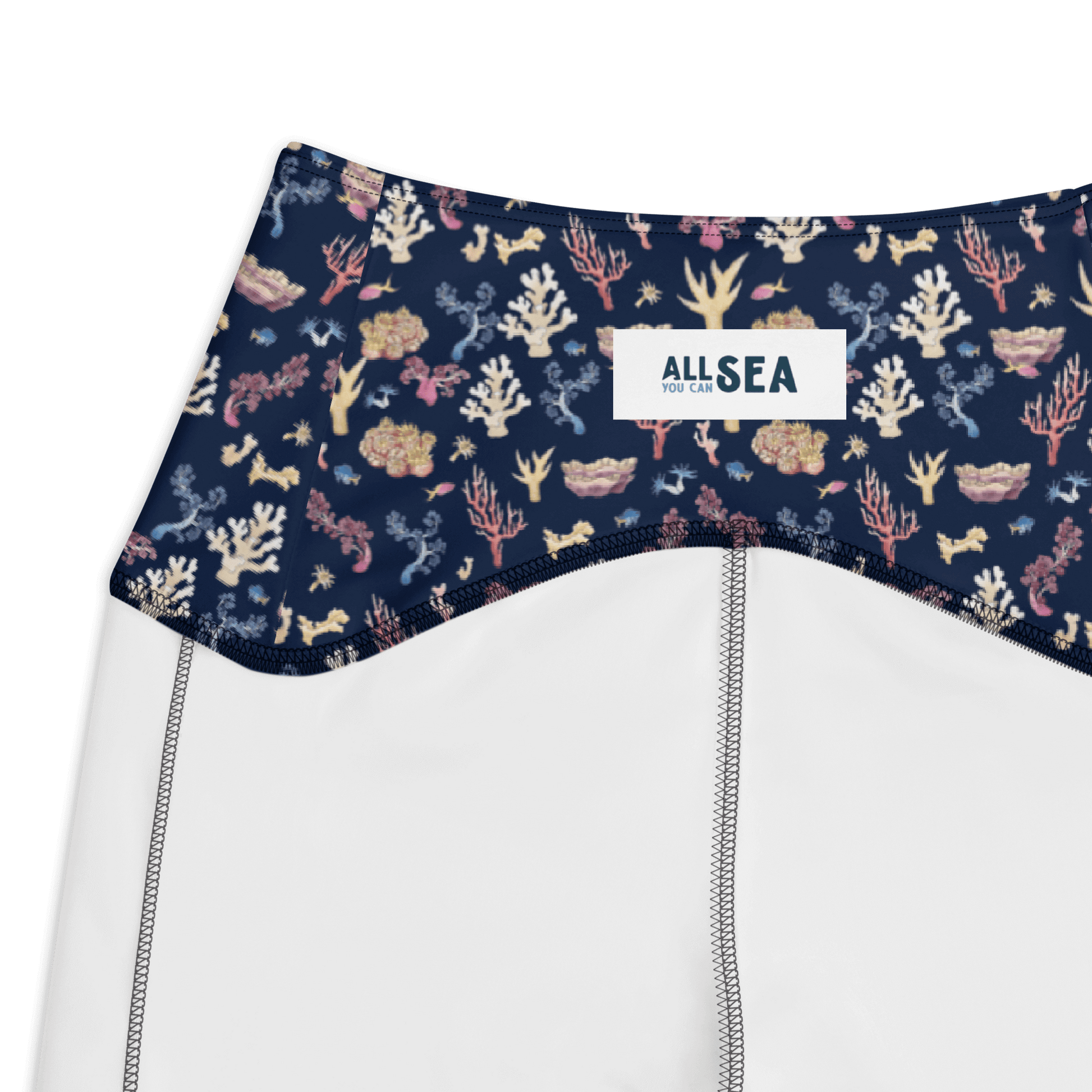 details of a navy blue leggings with a colorful coral and sea life pattern